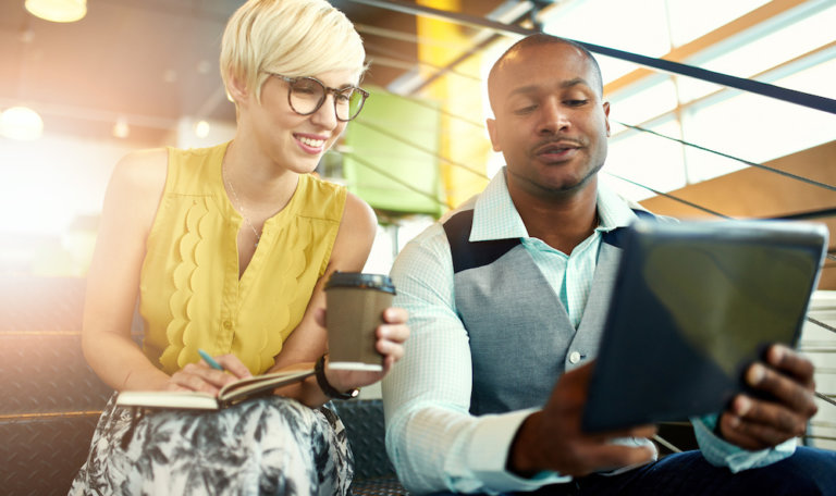 Employee mentors colleague on modern technology