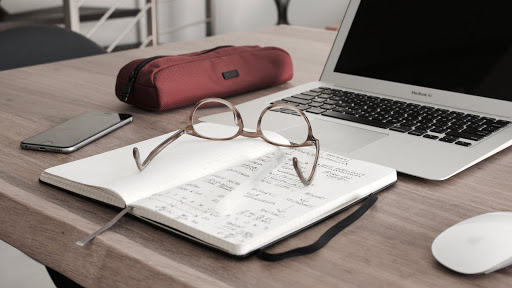 book, laptop, glasses