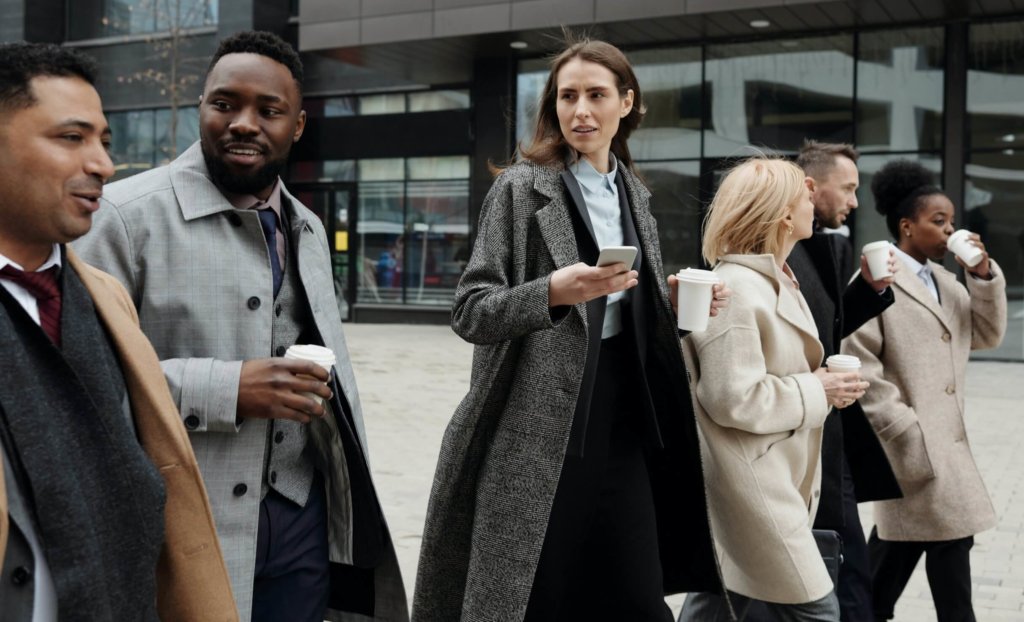 diverse employees getting coffee at workplace