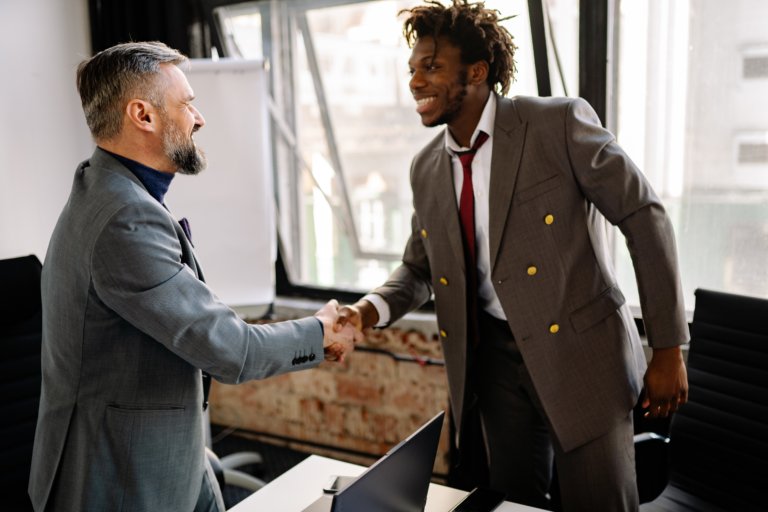 boss offers employee promotion as part of a succession planning process