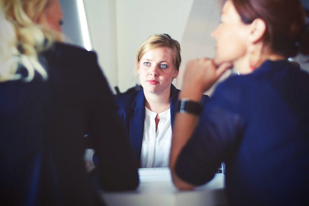 Woman in meeting with employees