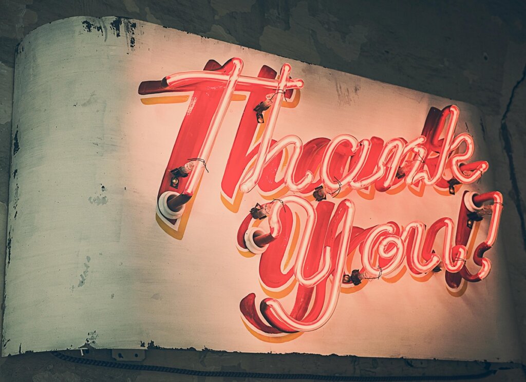 Thank you sign in neon to illustrate story on how to thank your mentor