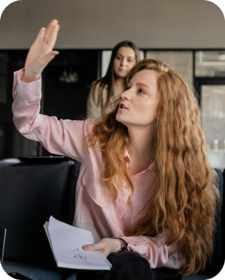 Woman raising hand to aks question