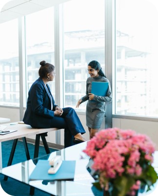 Women talking in office