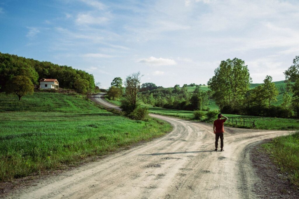 A person decides between two paths at a crossroads